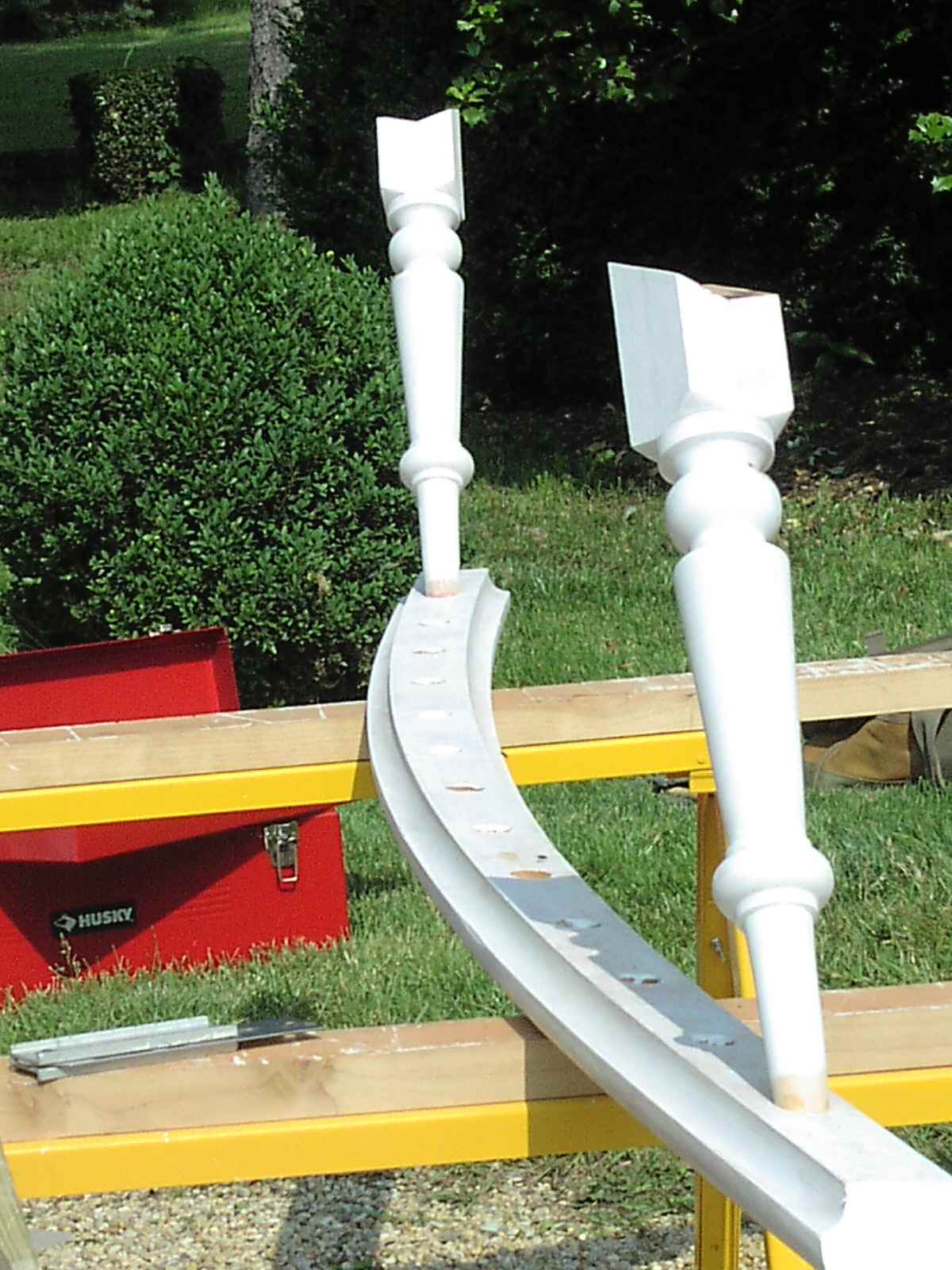 Fitting balusters to curved hand rail.