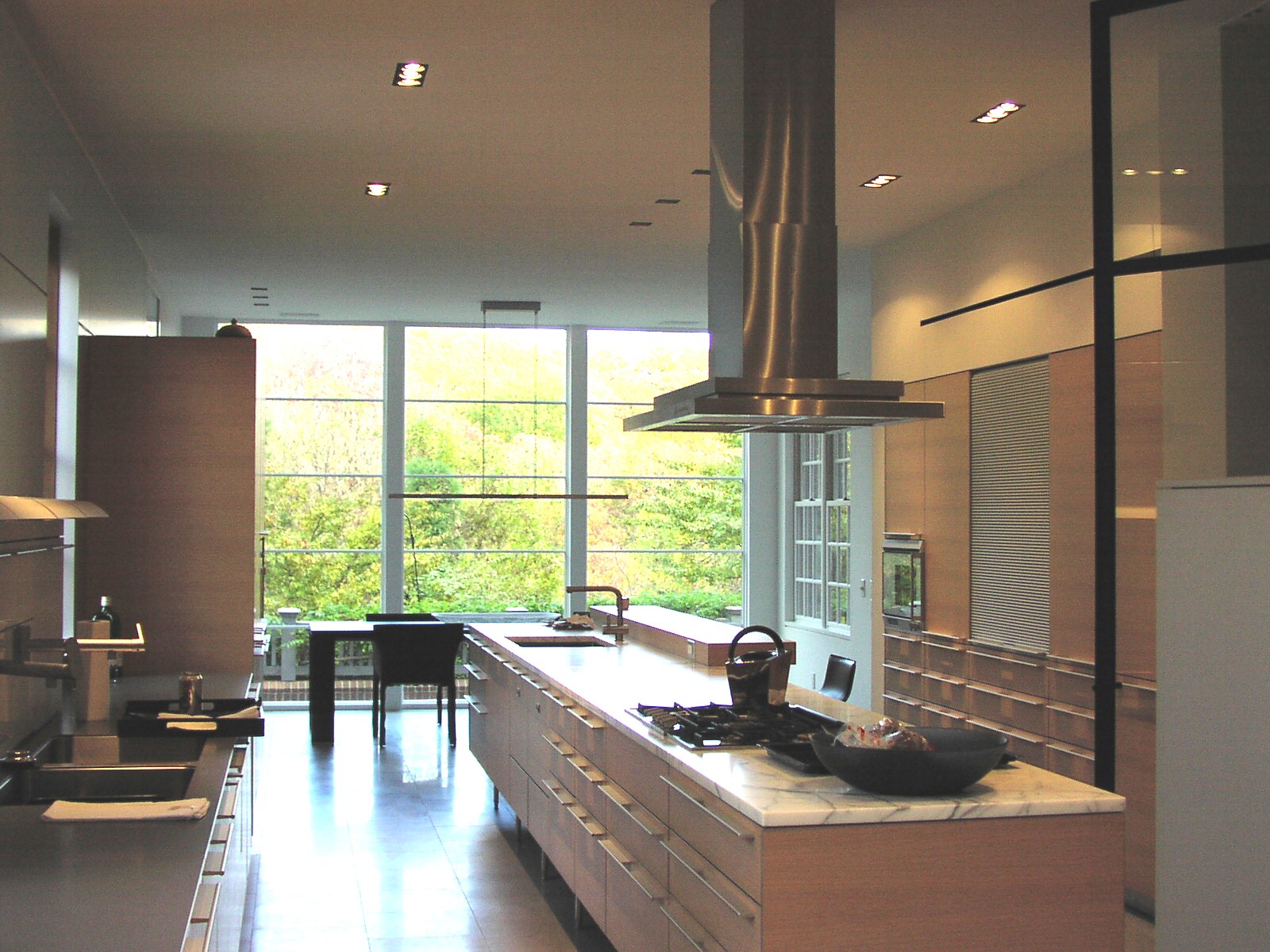 Modern kitchen with glass wall.